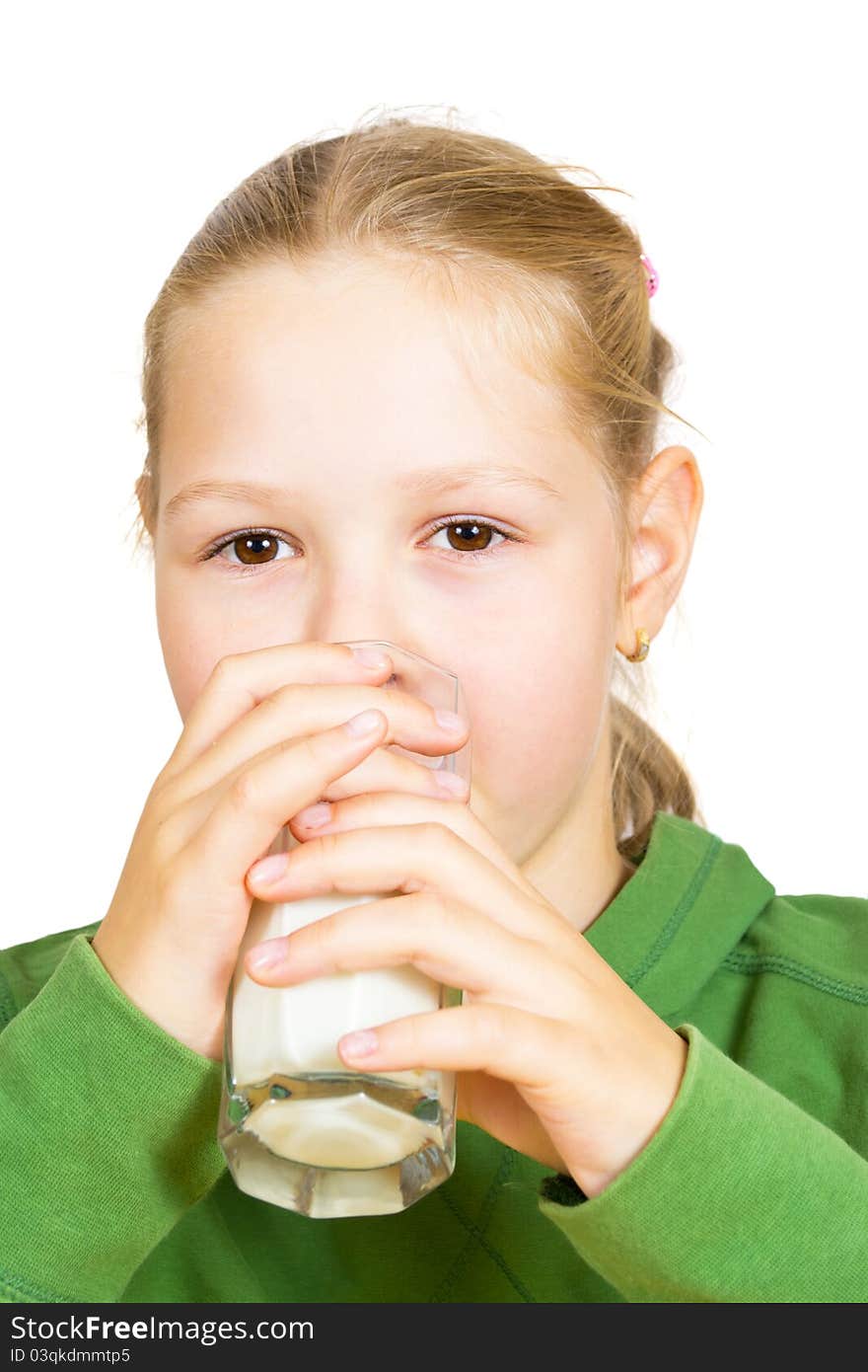 Happy little girl with a glass of milk, isolated over white