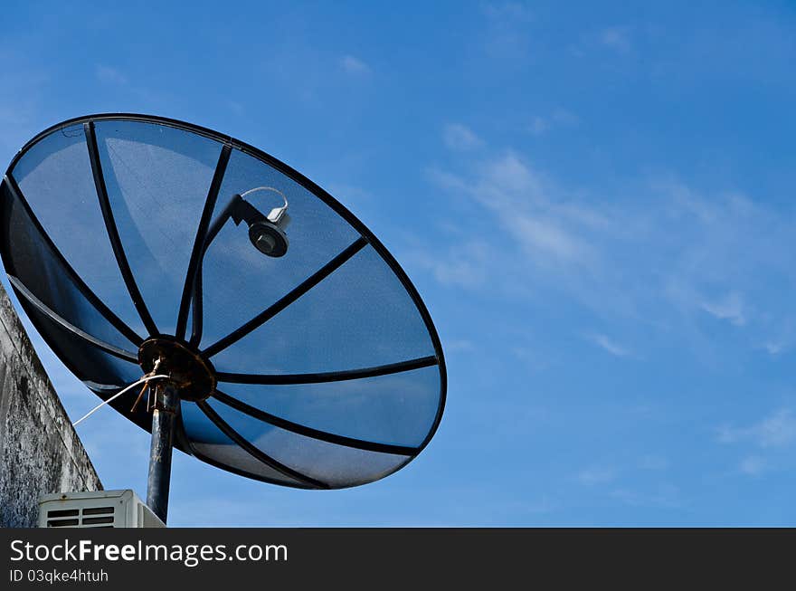 Big satellite dish and blue sky in the city