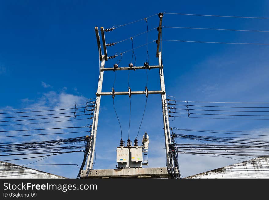 Electricity post with blue sky in the city