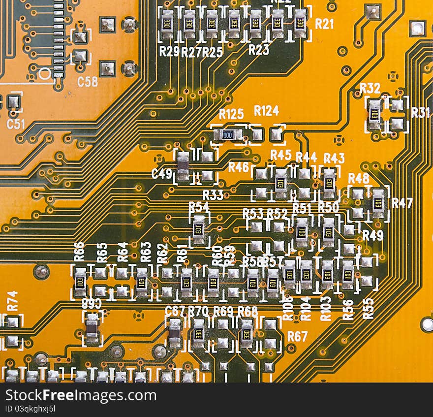 Yellow circuit board with components.