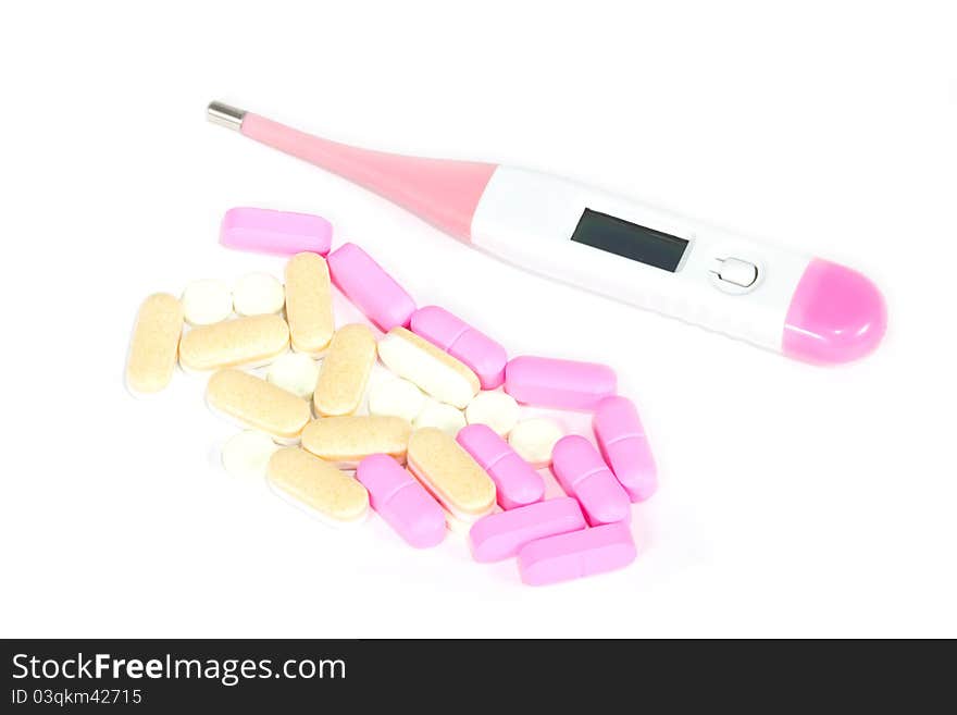 Digital thermometer and pills on white background. Digital thermometer and pills on white background.