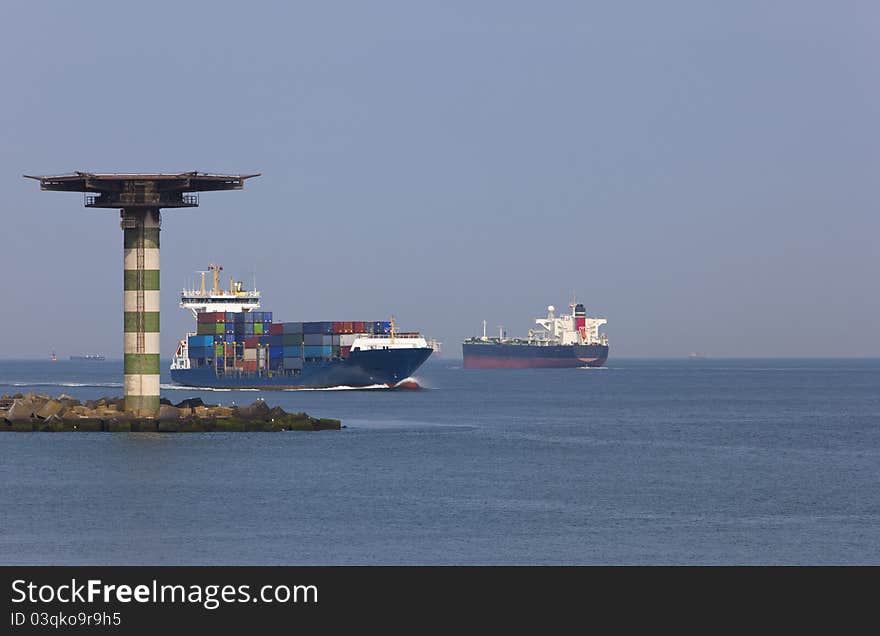 Containership entering the harbour of rotterdam