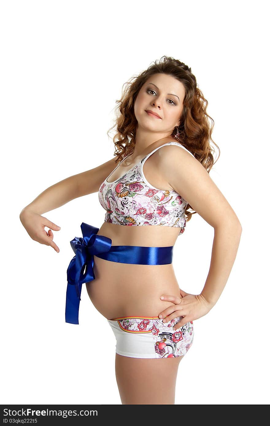 Young pregnant woman with a blue ribbon on his stomach