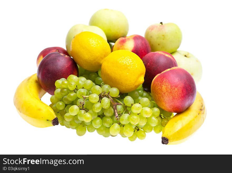 Apples, peaches, bananas, grapes on a white