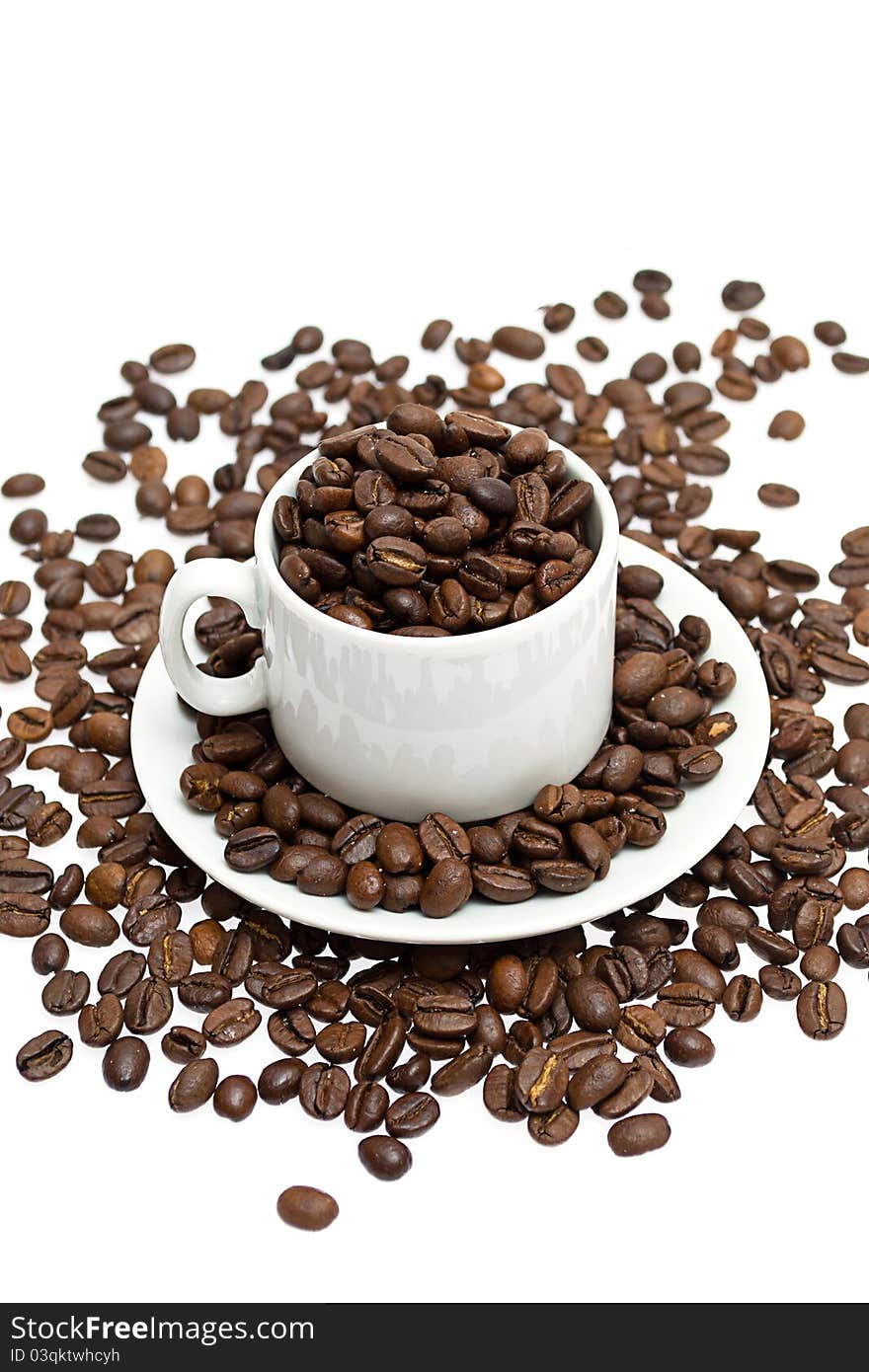 Coffee beans in a cup on white background