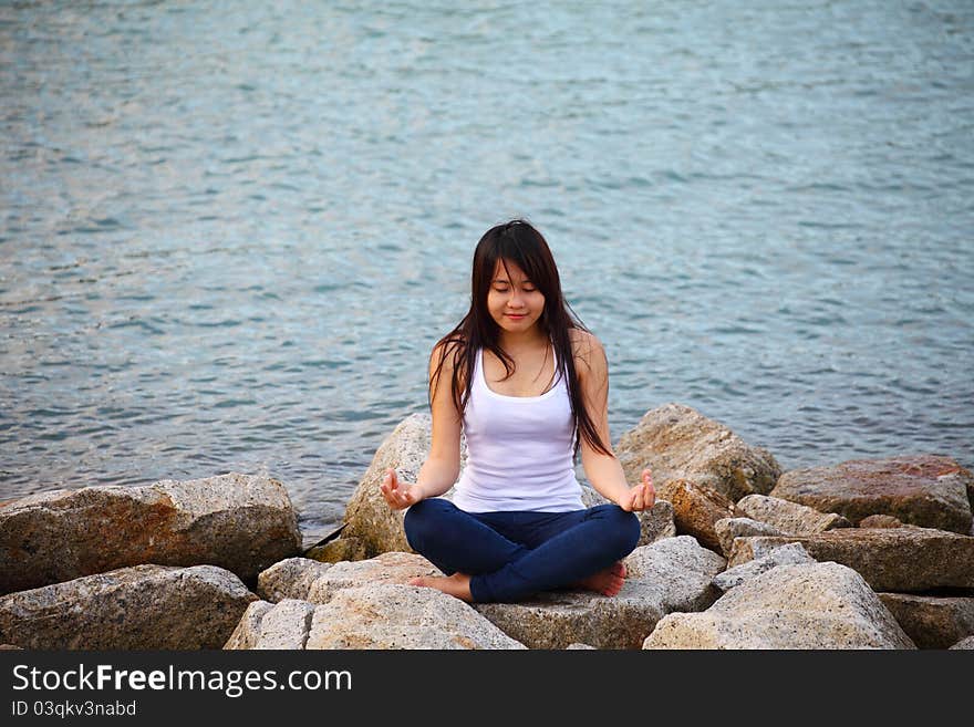 Beautiful Young Woman Doing Yoga Exercise