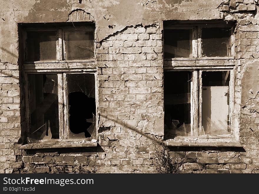 Broken windows in an old building