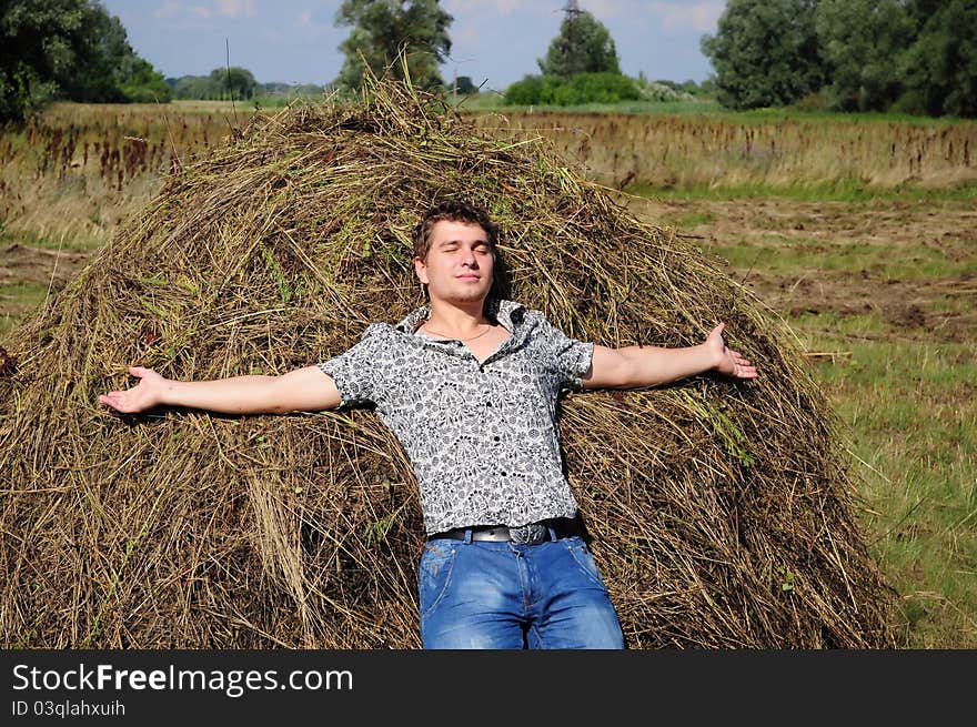 Picture a young man resting on the nature. Picture a young man resting on the nature