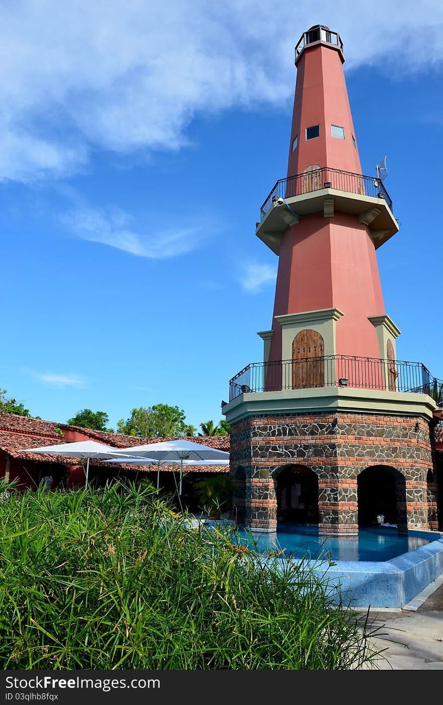 Modern lighthouse and pool bar in the tropics