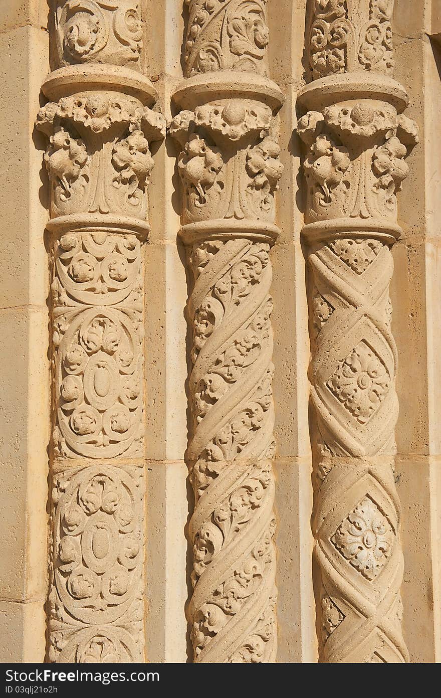 The Three Ornate, Circular, Old Pillars standing straight in a row made of stucco. The Three Ornate, Circular, Old Pillars standing straight in a row made of stucco