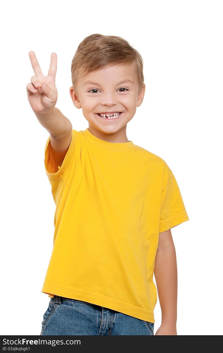 Portrait of little boy showing victory hand sign on white background. Portrait of little boy showing victory hand sign on white background