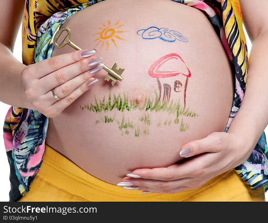 Tummy of pregnant woman with funny drawing over white background. Tummy of pregnant woman with funny drawing over white background