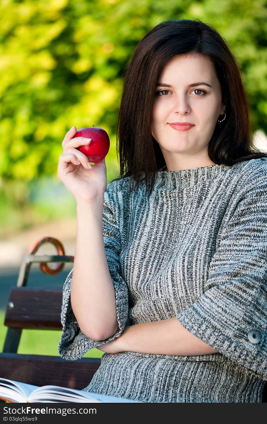 Portrait of a young female student with books at the campus