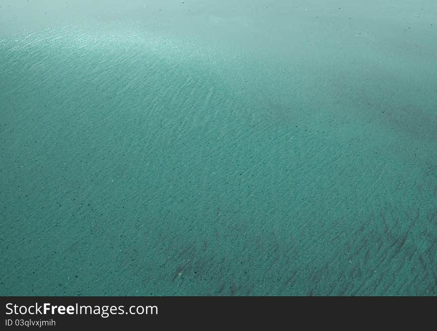 Water sand and light blur background