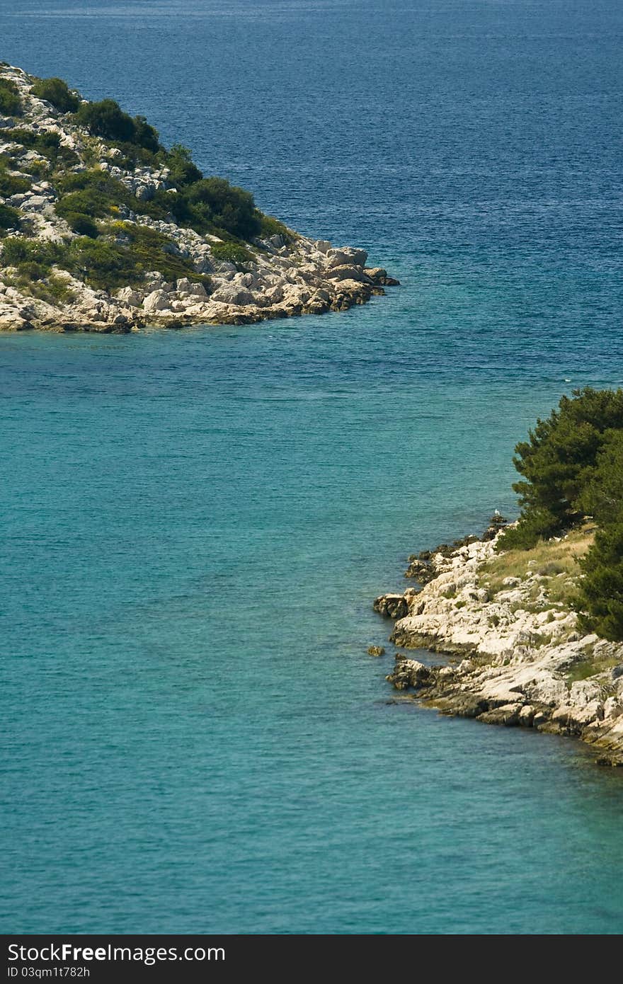 Rocky coasts of green islands in front of Tribunj. Rocky coasts of green islands in front of Tribunj