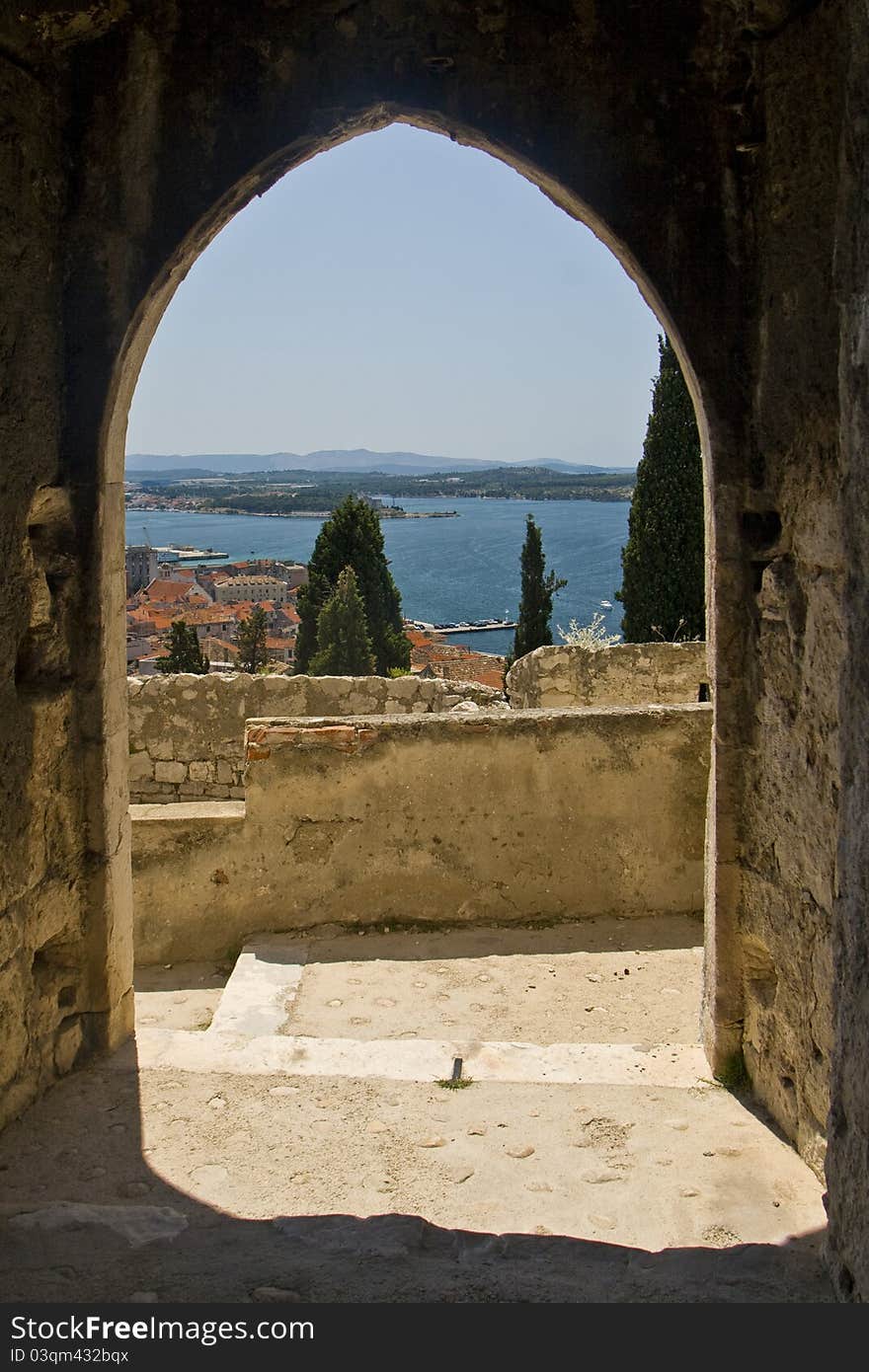 View on Sibenik and the sea through the arch gate of St.Michael. View on Sibenik and the sea through the arch gate of St.Michael