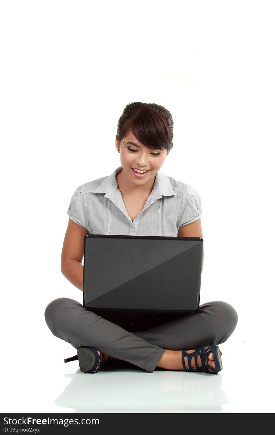 Young business woman on a laptop - isolated on white