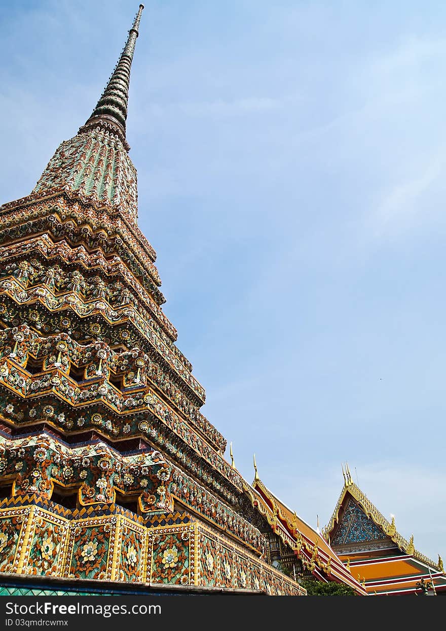 Ancient pagoda with Wat Phra Chetuphon Vimolmangklararm on the background , Wat Pho, the oldest historical sites in Bangkok , Thailand and that Thailand's tourism. Ancient pagoda with Wat Phra Chetuphon Vimolmangklararm on the background , Wat Pho, the oldest historical sites in Bangkok , Thailand and that Thailand's tourism