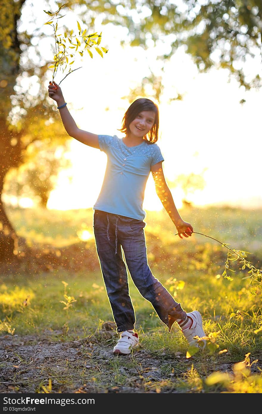 Girl play against the sun in autumn time