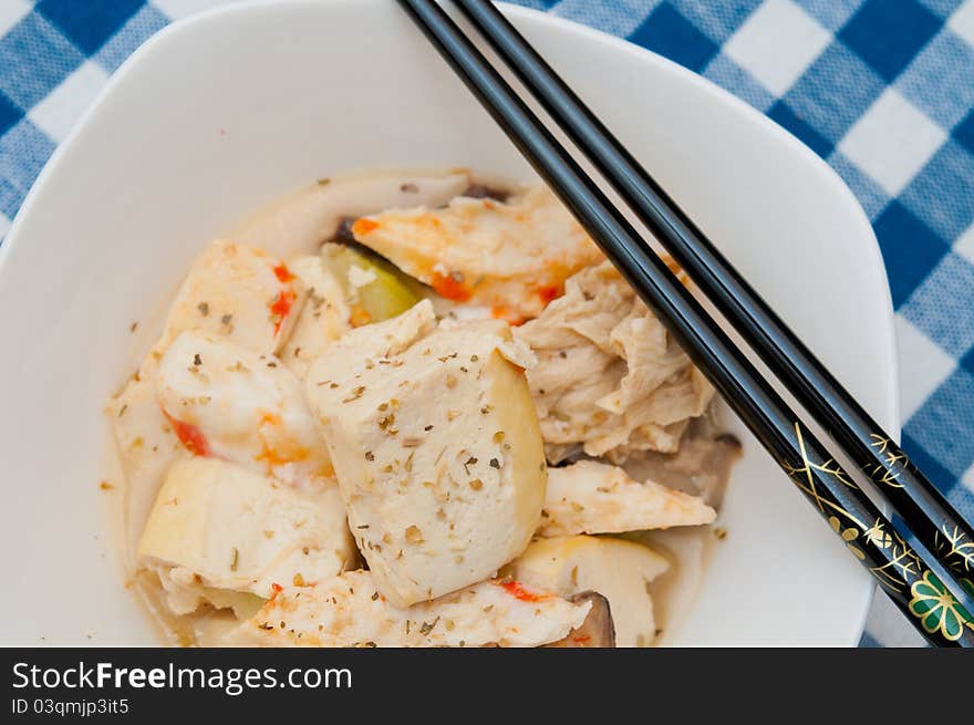 Oriental style vegetarian seafood delicacy with chopsticks on white bowl. Oriental style vegetarian seafood delicacy with chopsticks on white bowl.