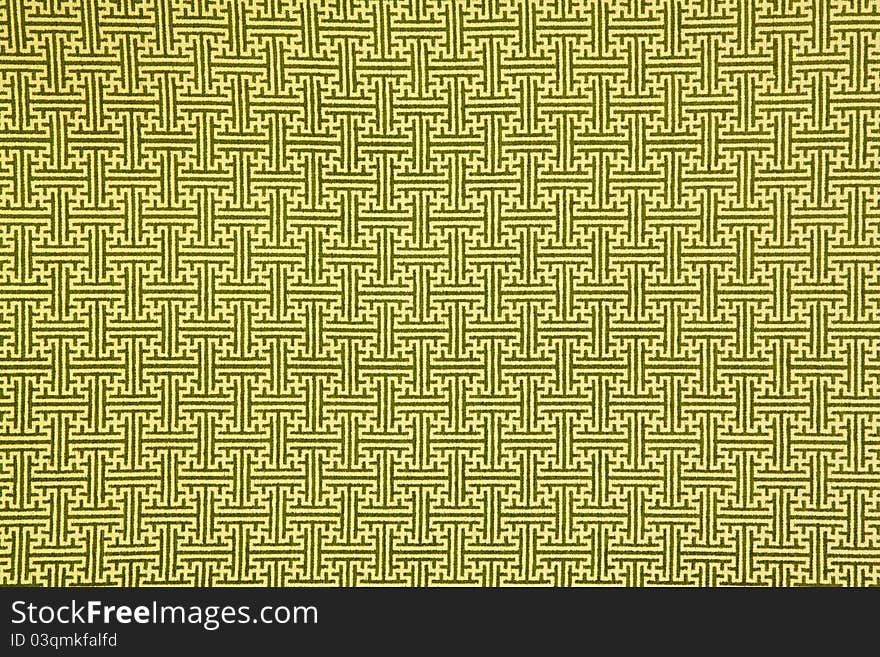 Pattern of yellow maze clothing wall paper, close up