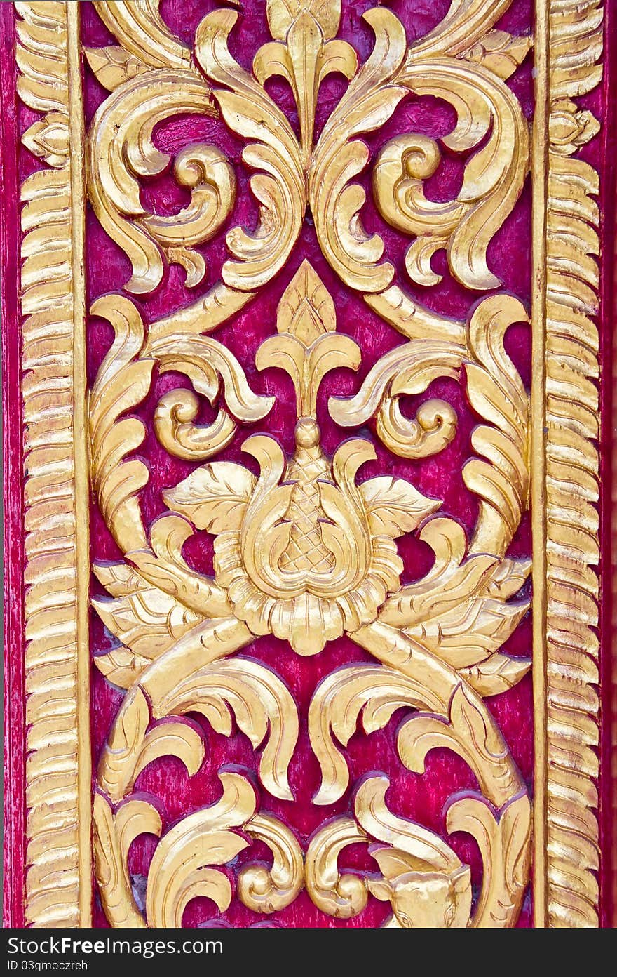 Thai style wood carving on teak texture in thai temple