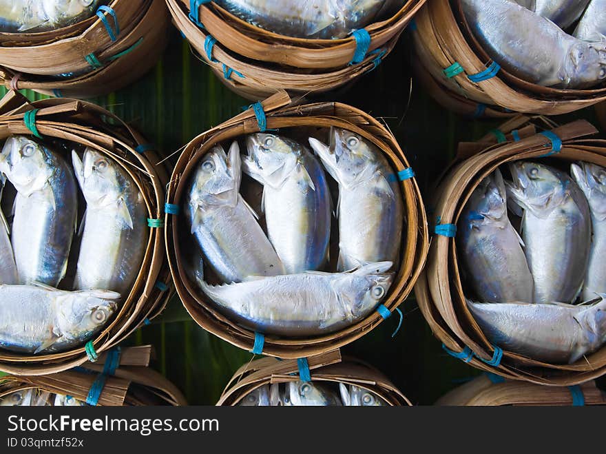 Mackerel fish in bamboo basket at market, Thailand