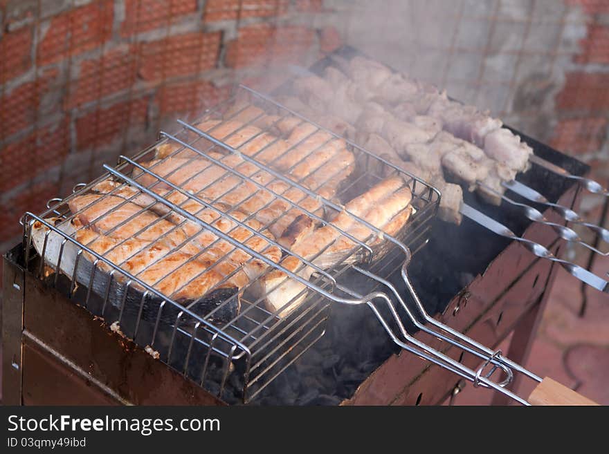 Shish kebab from a salmon on a lattice in the garden