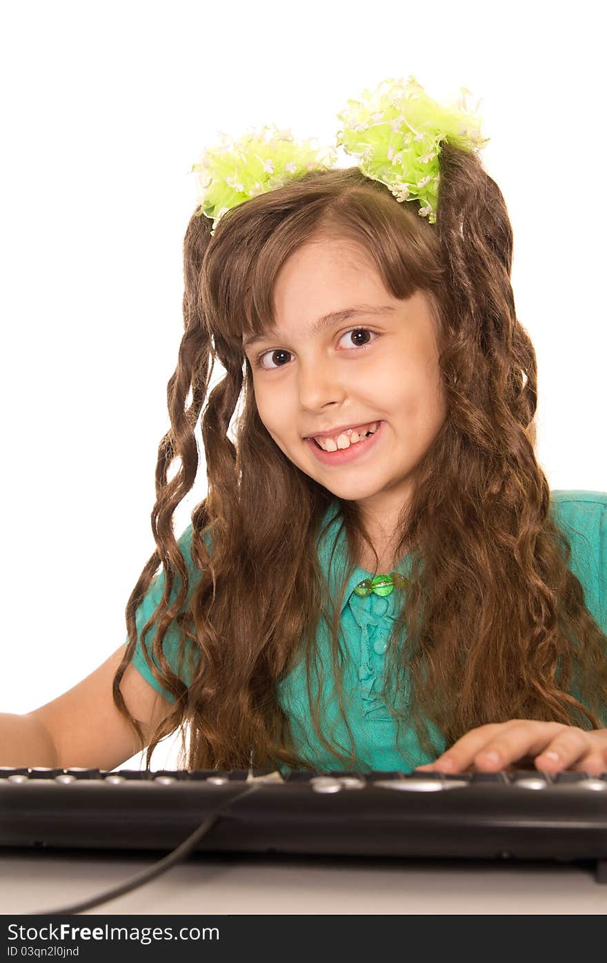 Cute little girl with a computer on white. Cute little girl with a computer on white