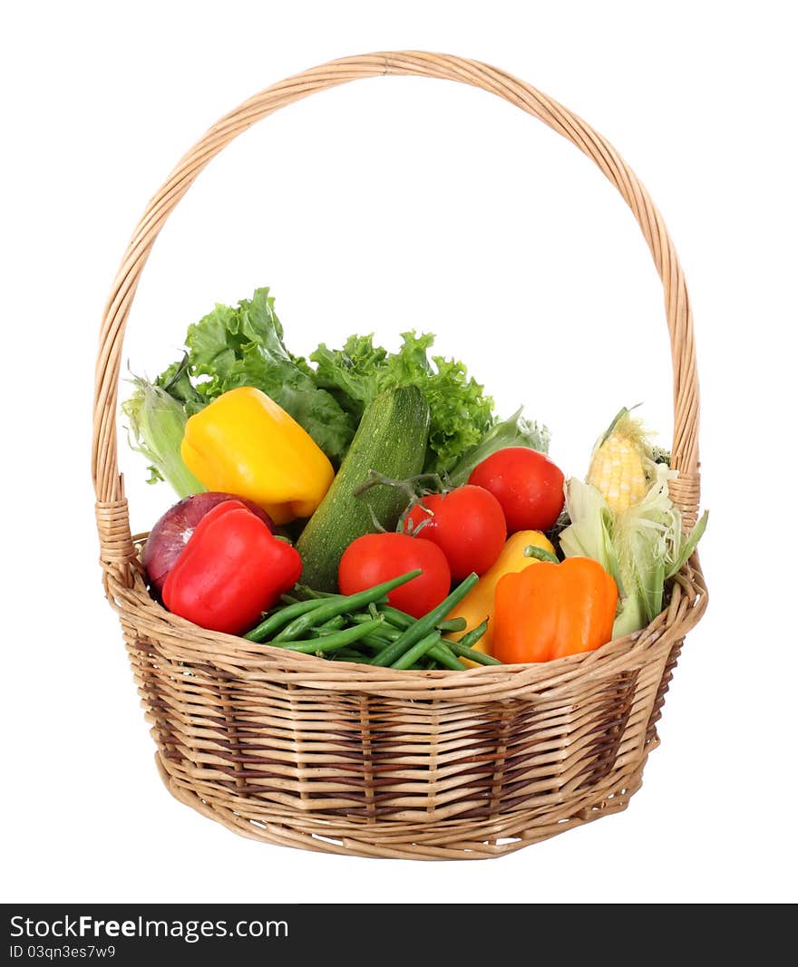 Basket of vegetables isolated on a white background. Basket of vegetables isolated on a white background