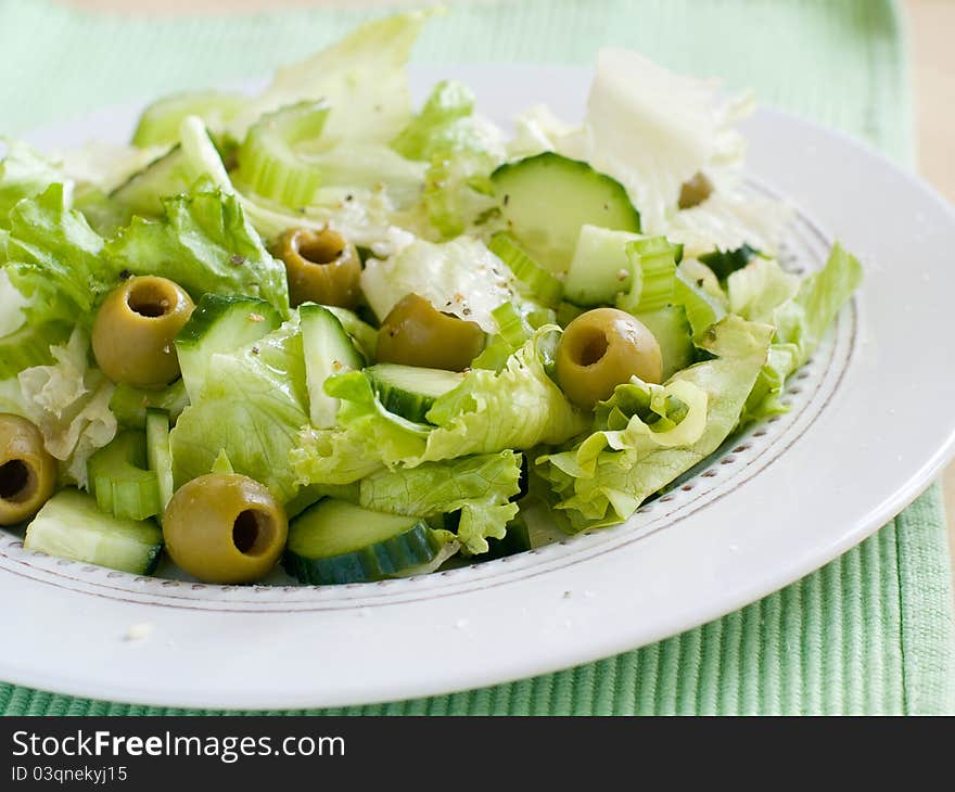 Fresh vegetable salad with olive. Selective focus