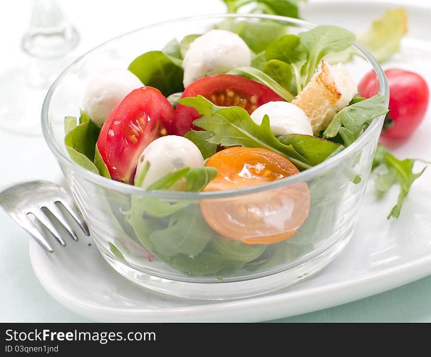 Fresh salad with vegetables and mozarella. Selective focus