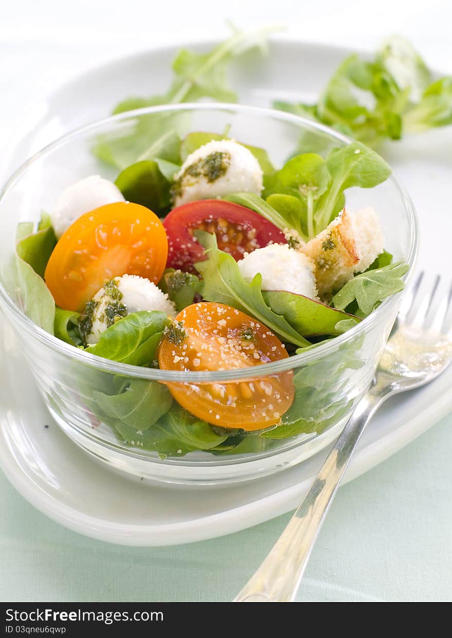 Fresh salad with vegetables and mozarella. Selective focus