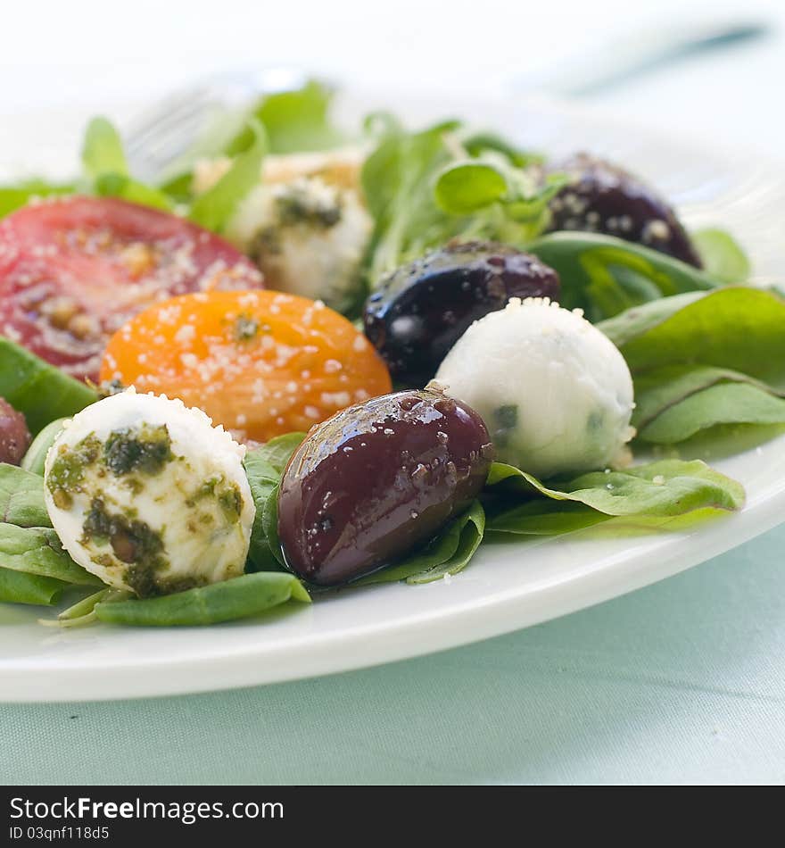 Fresh salad with vegetables and mozarella. Selective focus