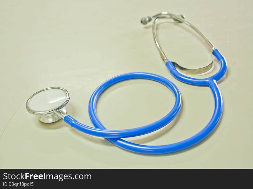 Blue color stethoscope on the table. Blue color stethoscope on the table