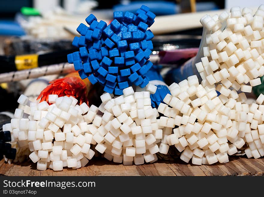 Bundles of colorful cable ties found on a tool vendors table at a swap meet. Bundles of colorful cable ties found on a tool vendors table at a swap meet.