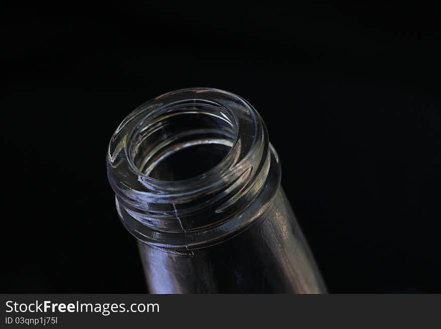 Bottle neck glass on black background