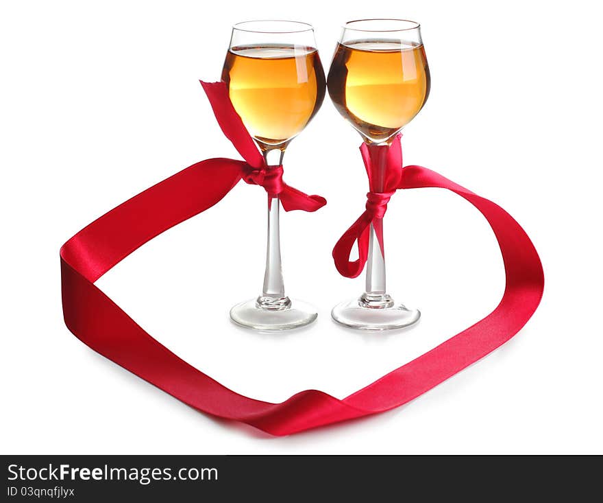 Color photo of wine glasses and a red ribbon. Color photo of wine glasses and a red ribbon