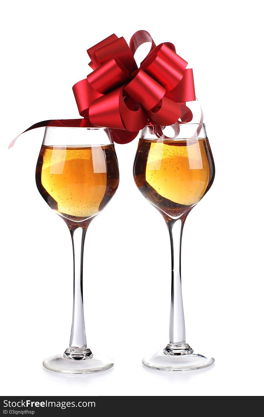 Color photo of wine glasses and a red ribbon. Color photo of wine glasses and a red ribbon