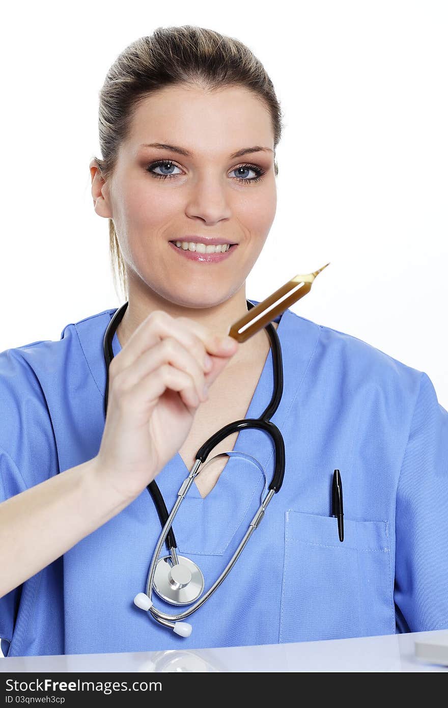 Woman doctor looks at an ampoule with a medicine