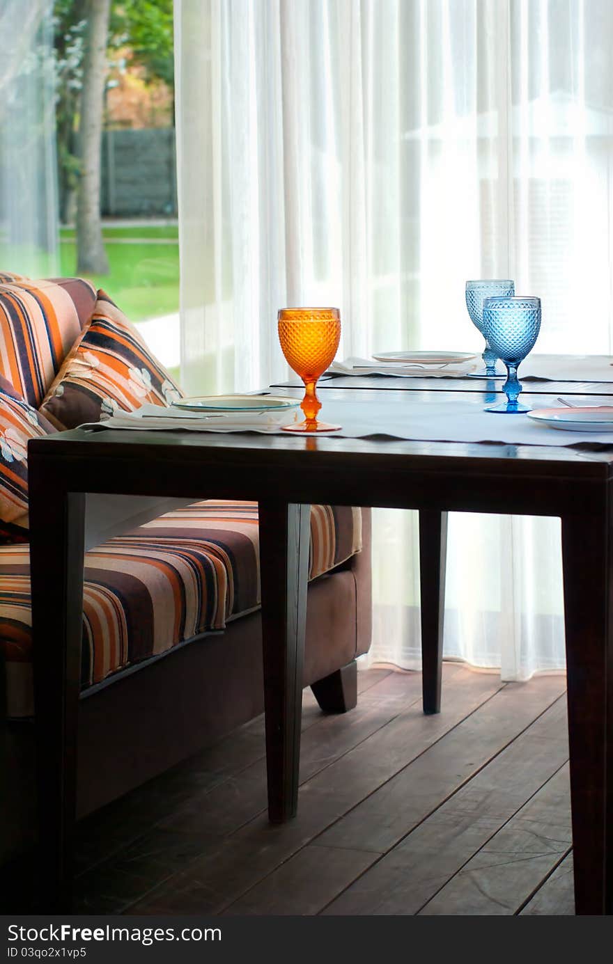 Wine glass on a table decorated for an event celebration Note to editor: