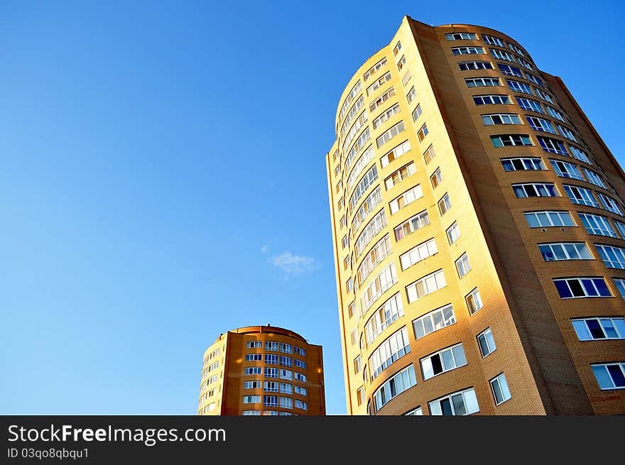 High-rise glass building with sky and clouds reflection. High-rise glass building with sky and clouds reflection