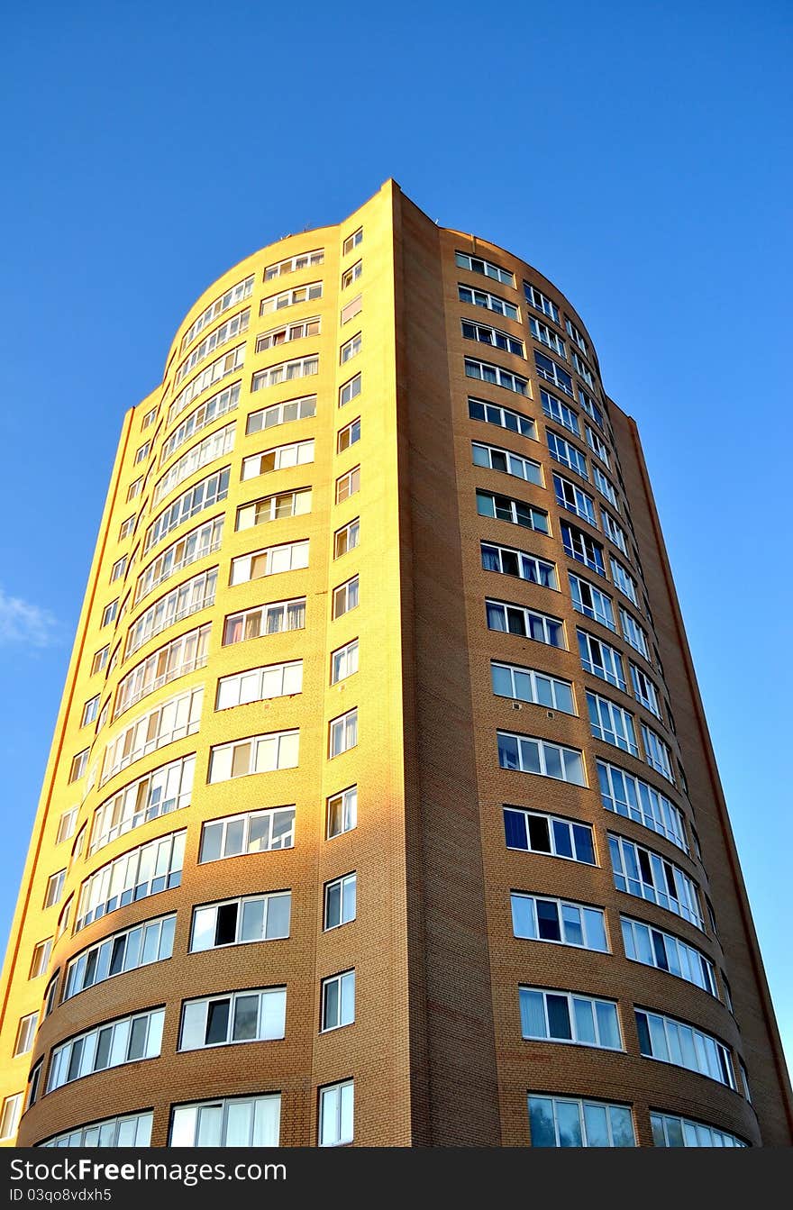 High-rise glass building with sky and clouds reflection. High-rise glass building with sky and clouds reflection