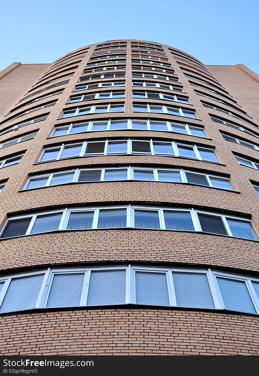 High-rise glass building with sky and clouds reflection. High-rise glass building with sky and clouds reflection