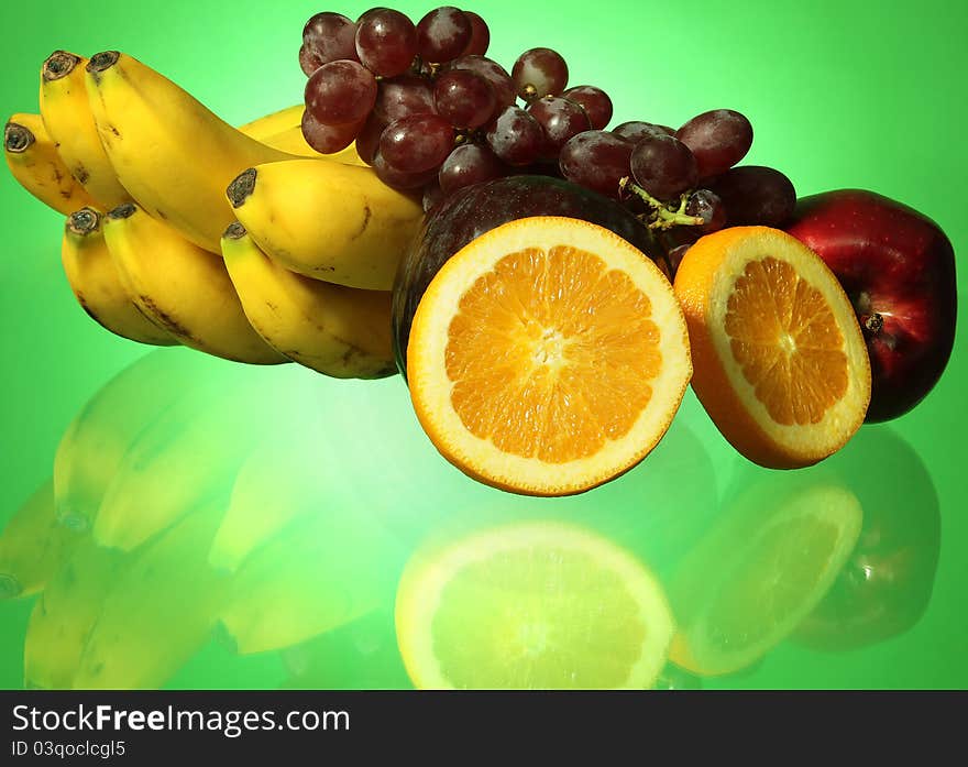 Fruit on green background