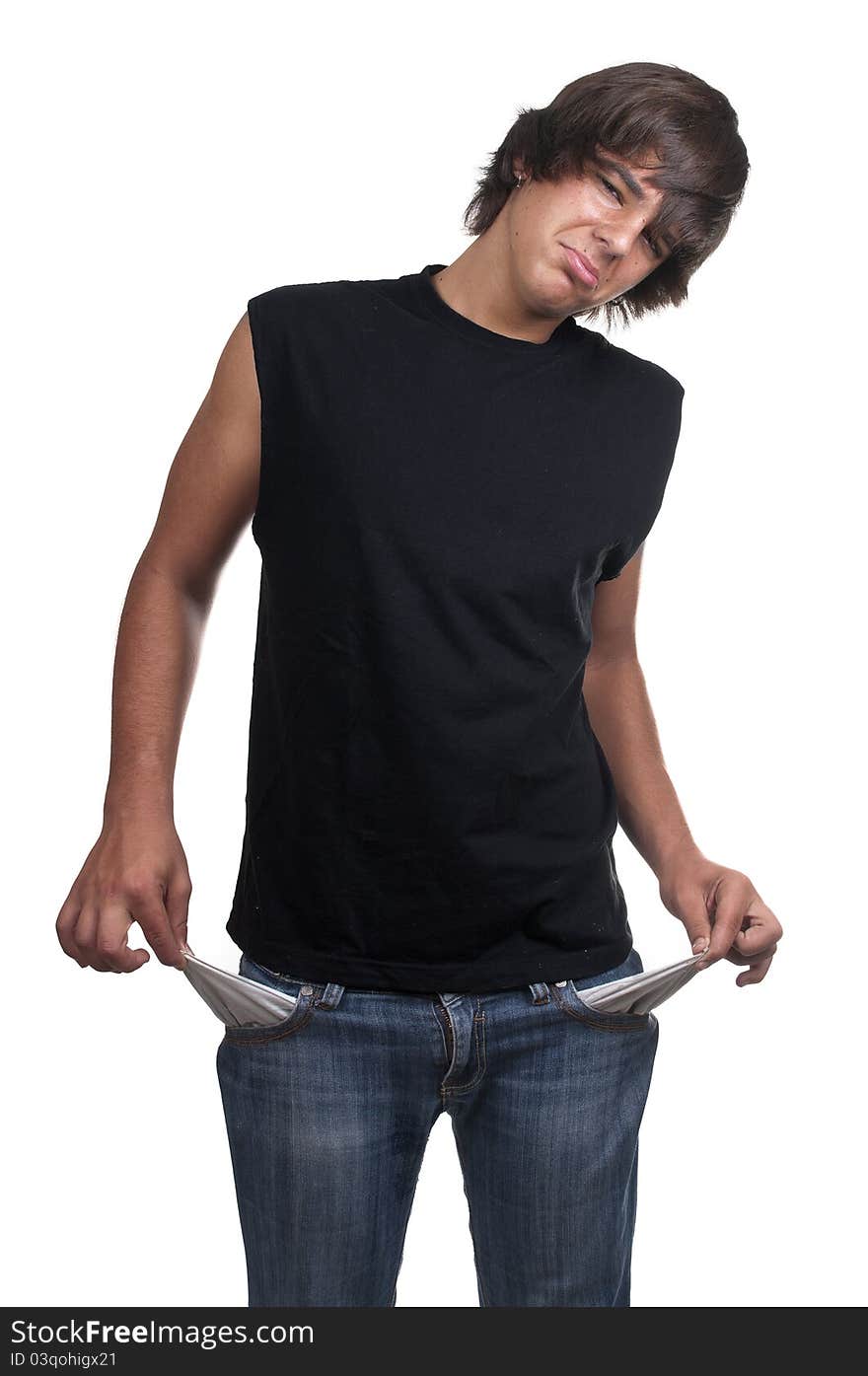 Teen showing his empty pockets on white background