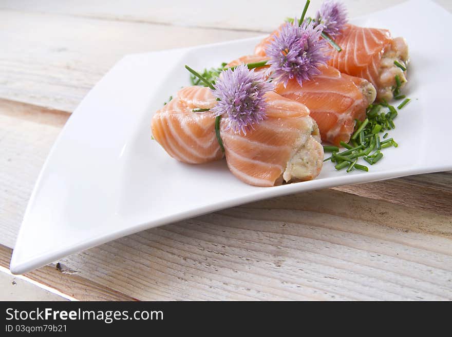 Mediterranean diet, main course, rolls of raw salmon. Mediterranean diet, main course, rolls of raw salmon