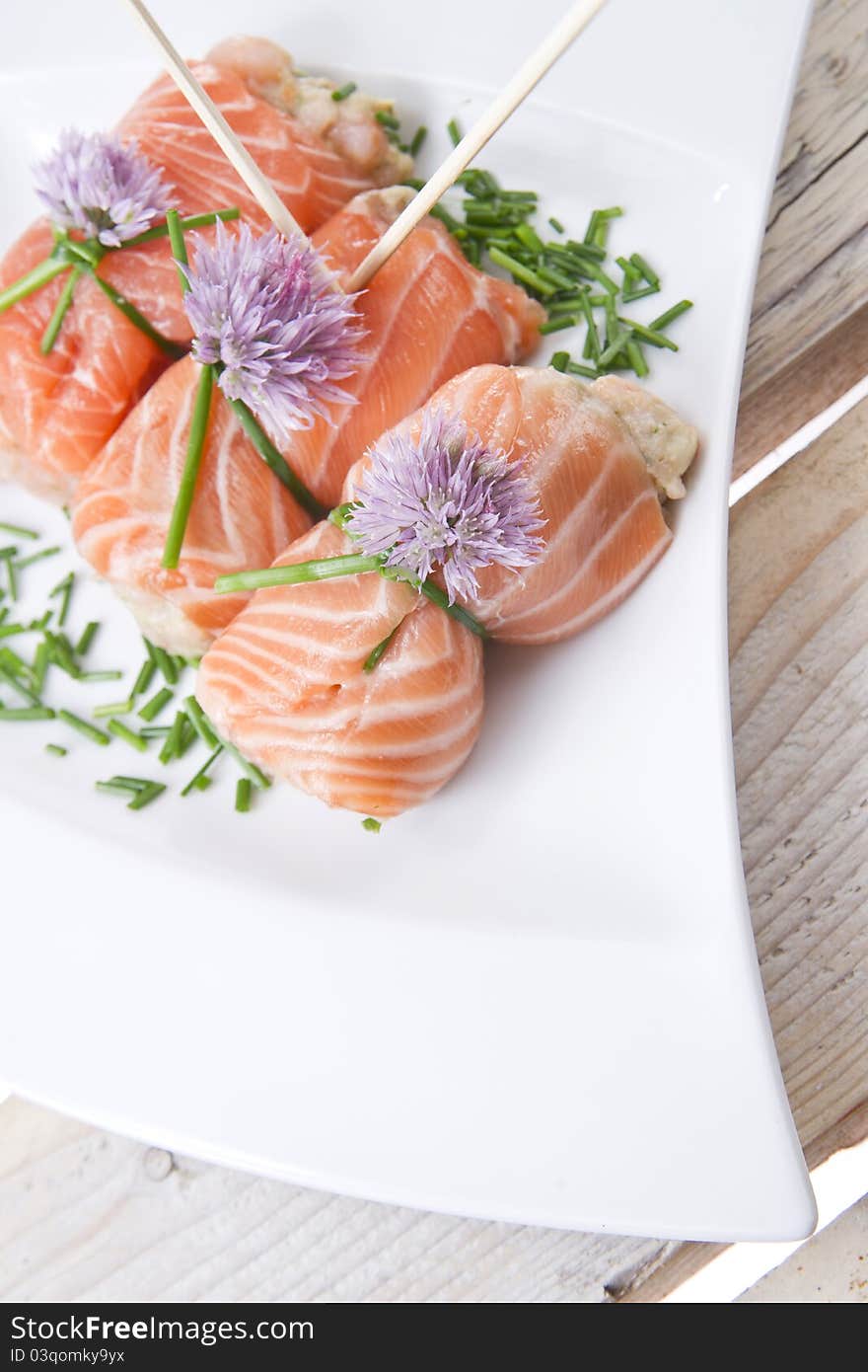 Mediterranean diet, main course, rolls of raw salmon. Mediterranean diet, main course, rolls of raw salmon