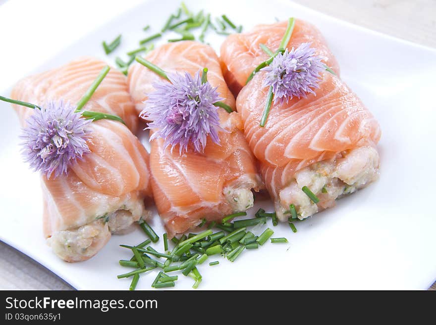 Mediterranean diet, main course, rolls of raw salmon. Mediterranean diet, main course, rolls of raw salmon