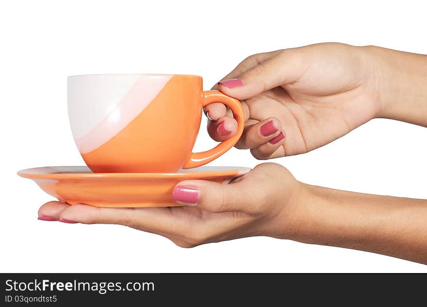 A cup in a hand is isolated on a white background